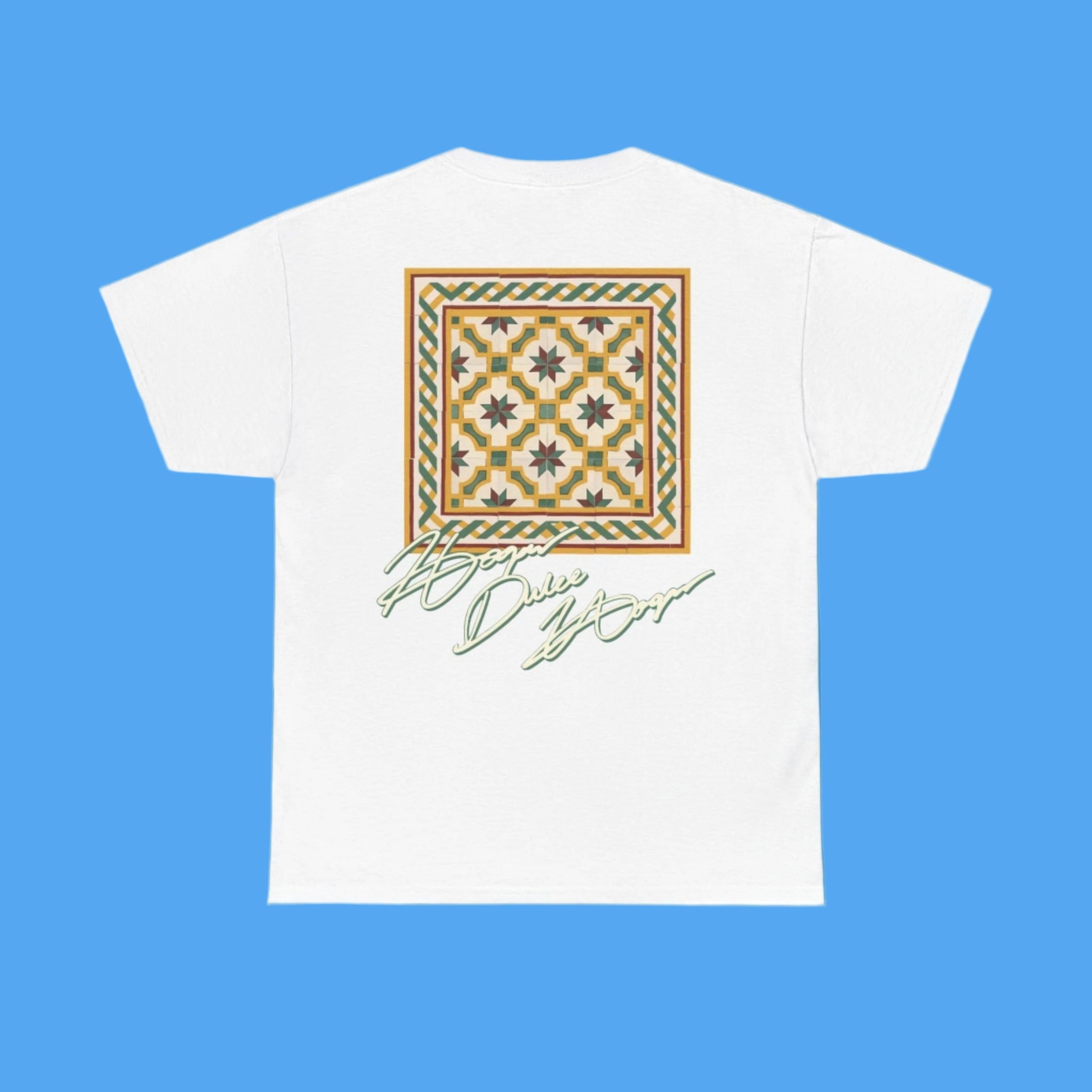 White t-shirt with a decorative pattern and text on a blue background